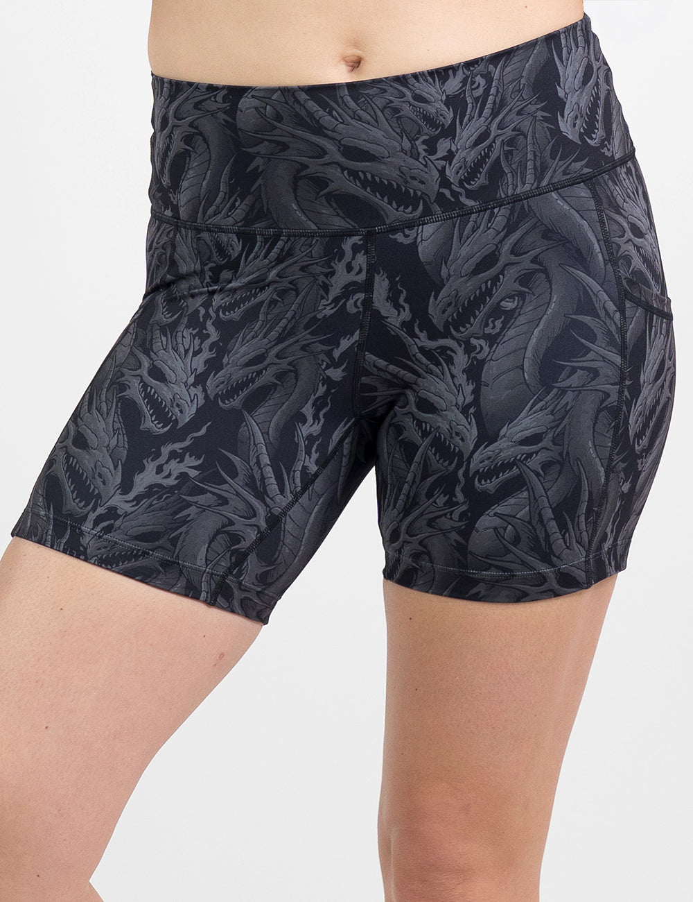 model wearing the 5 inch black shorts with a grey dragon pattern against a white background