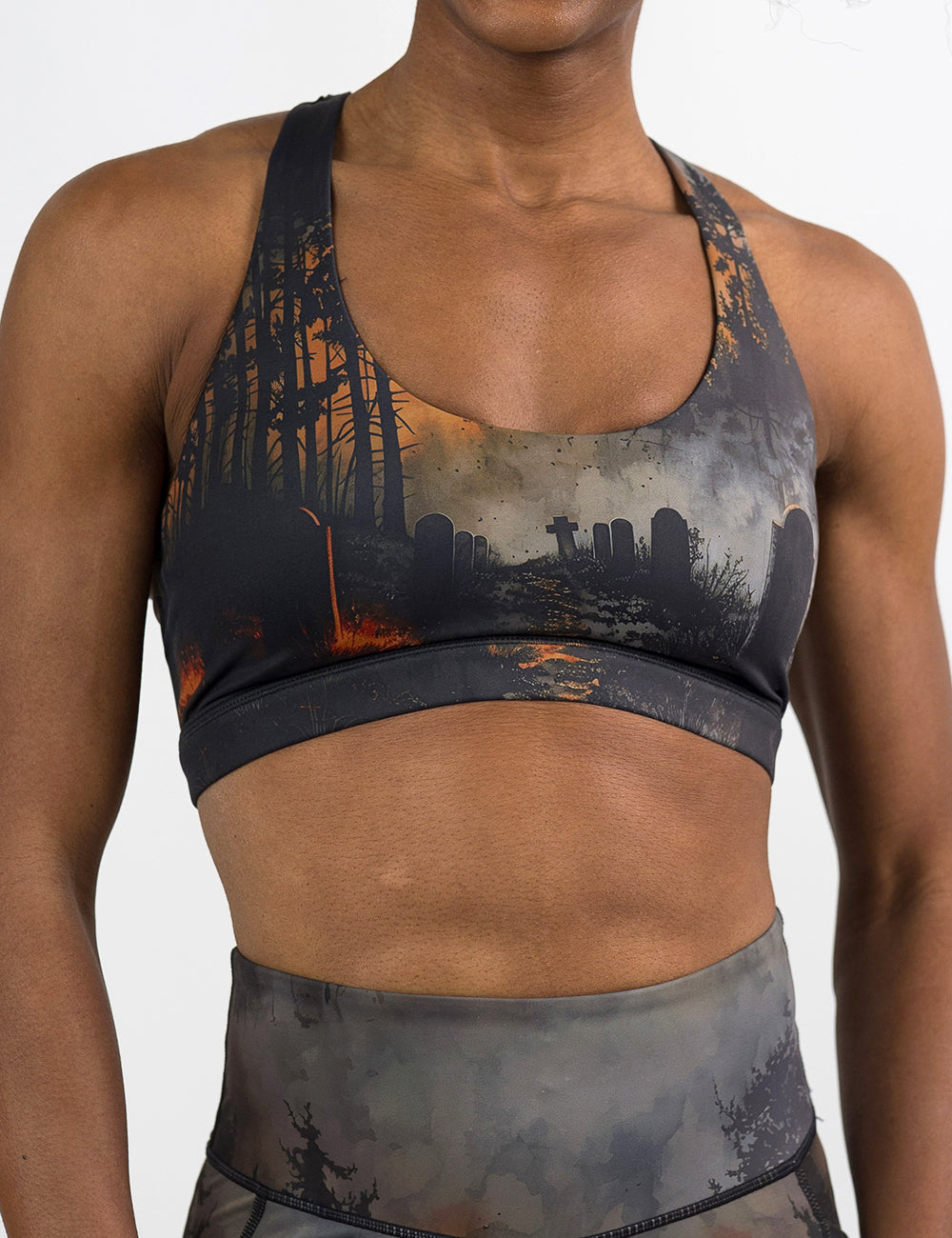 front of the dark cemetery with a full moon bra against a white background