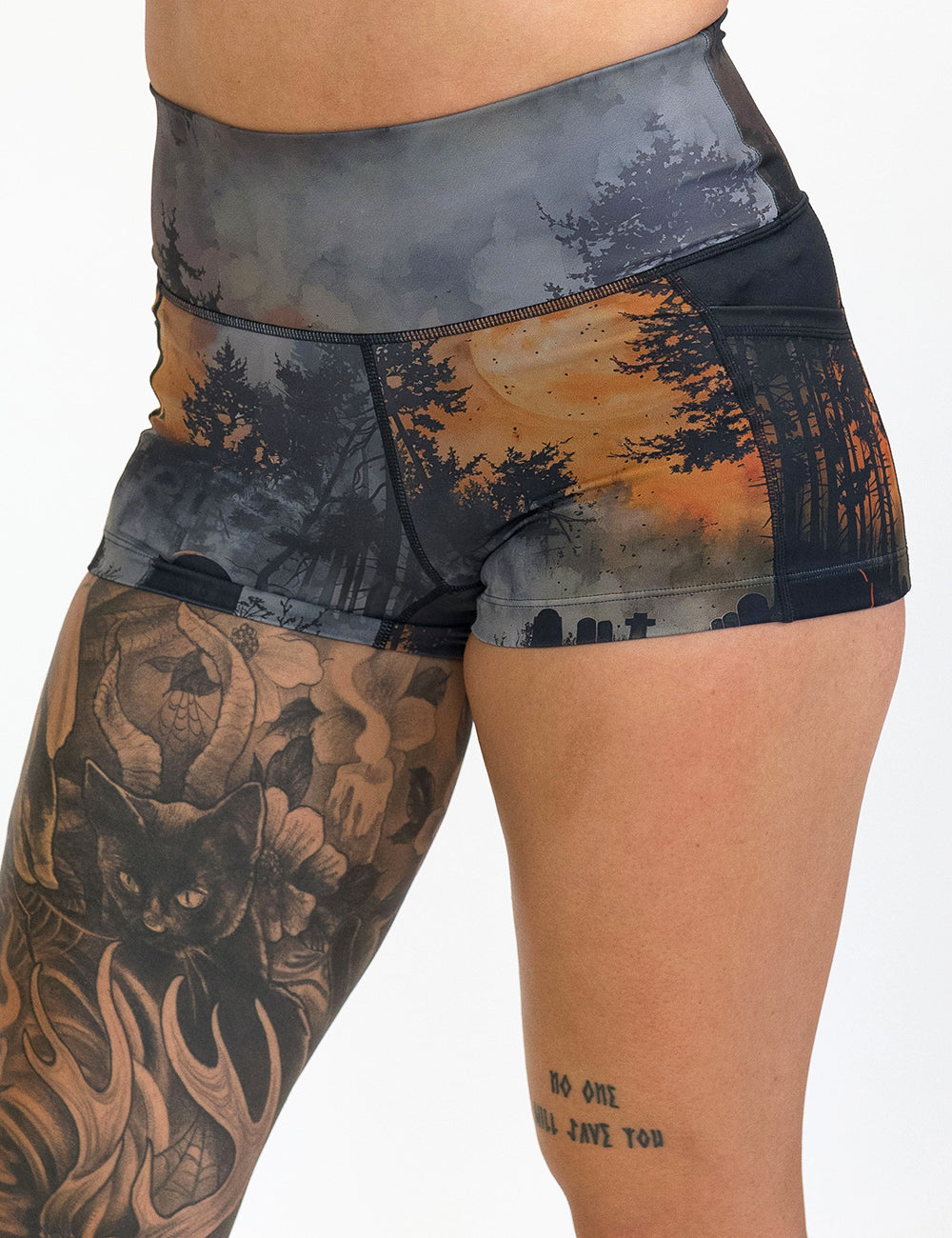 front of the dark cemetery with a full moon 2.5 inch shorts against a white background