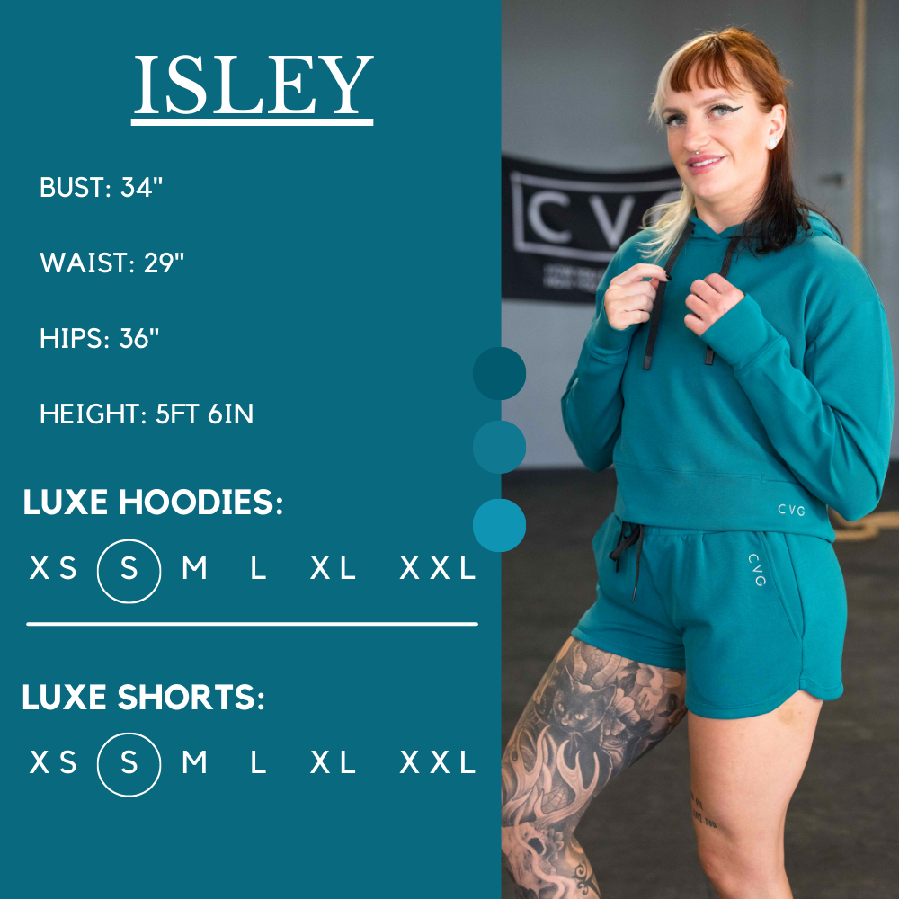 Model’s measurements of 34” bust, 29” waist, 36” hips and height of 5 ft 6 in. She is wearing a size small in our luxe shorts