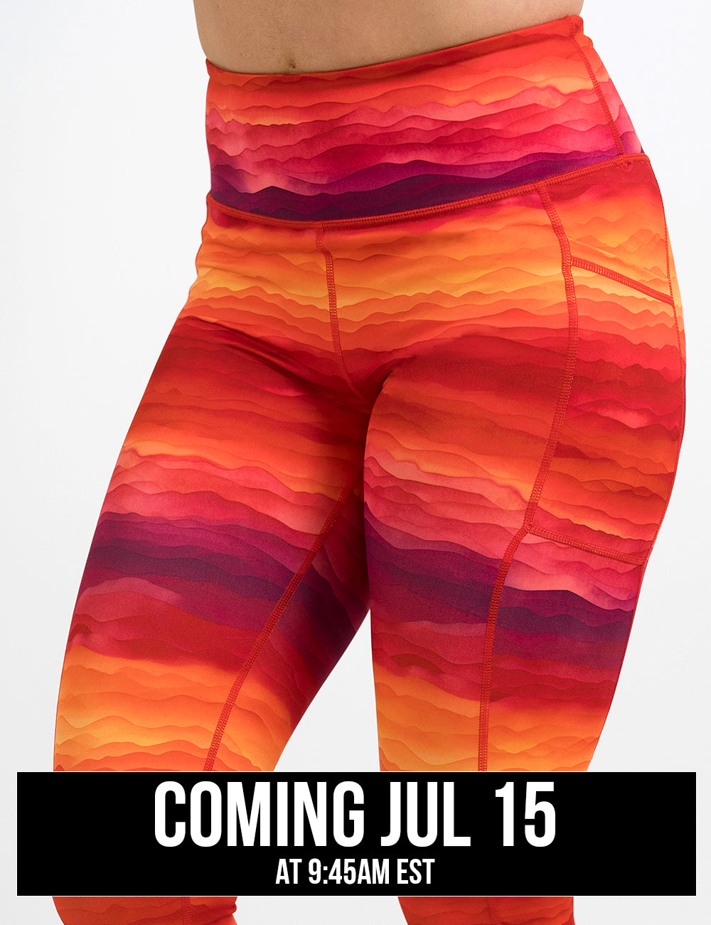 front of the orange, red, and yellow sunset stripes pattern leggings against a white background, coming july 15th