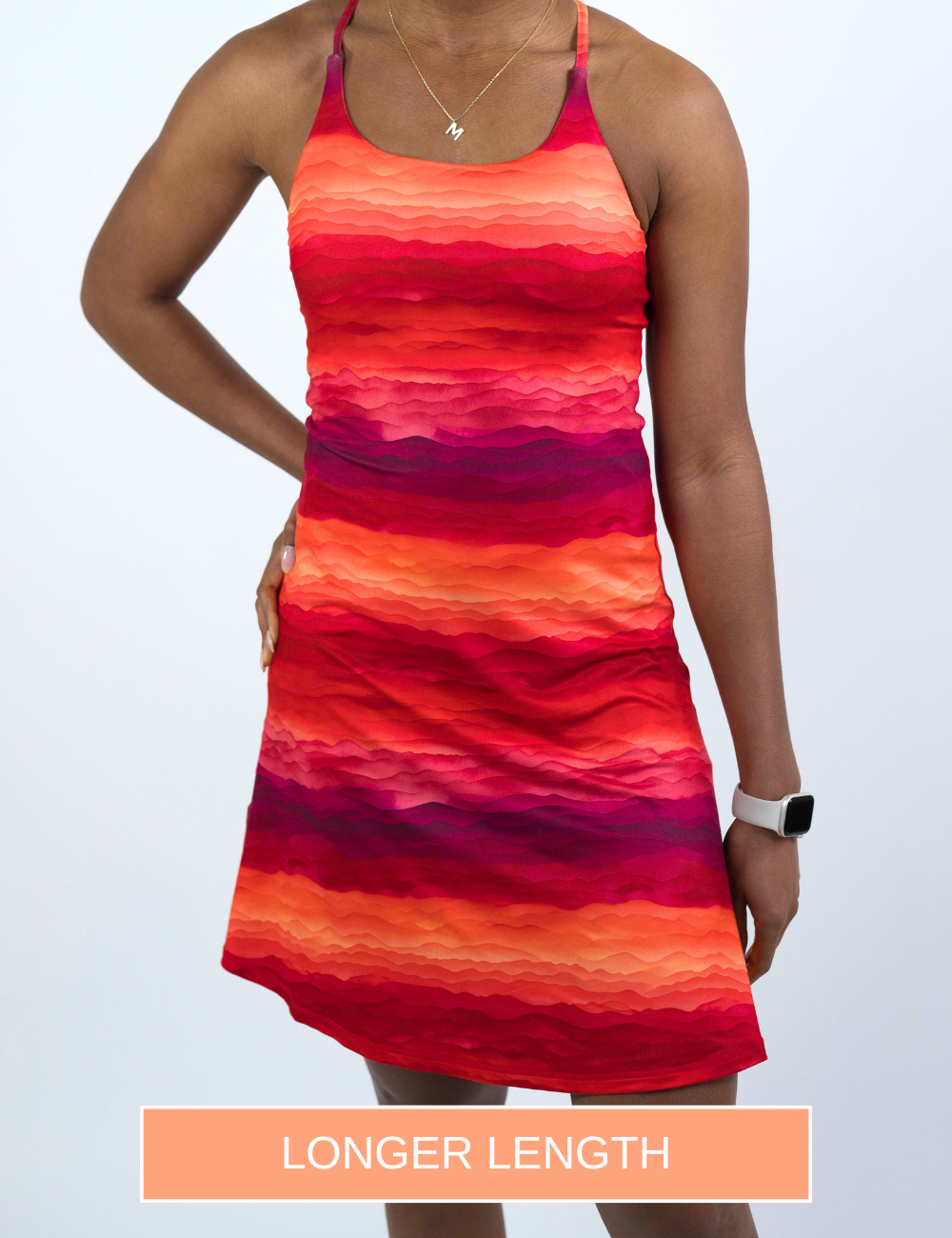 model wearing the longer length red desert sunset dress against a white background