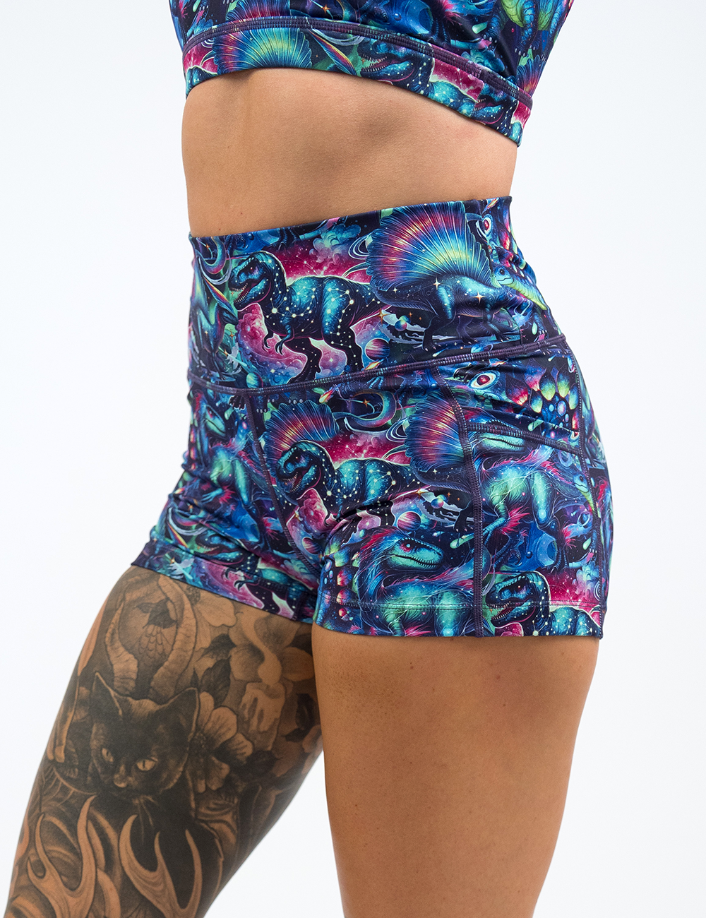 front of the colorful dinosaur 2.5 inch shorts against a white background