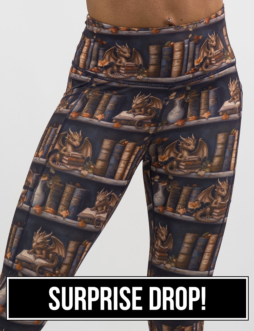 front of the gold dragons reading books leggings, surprise drop