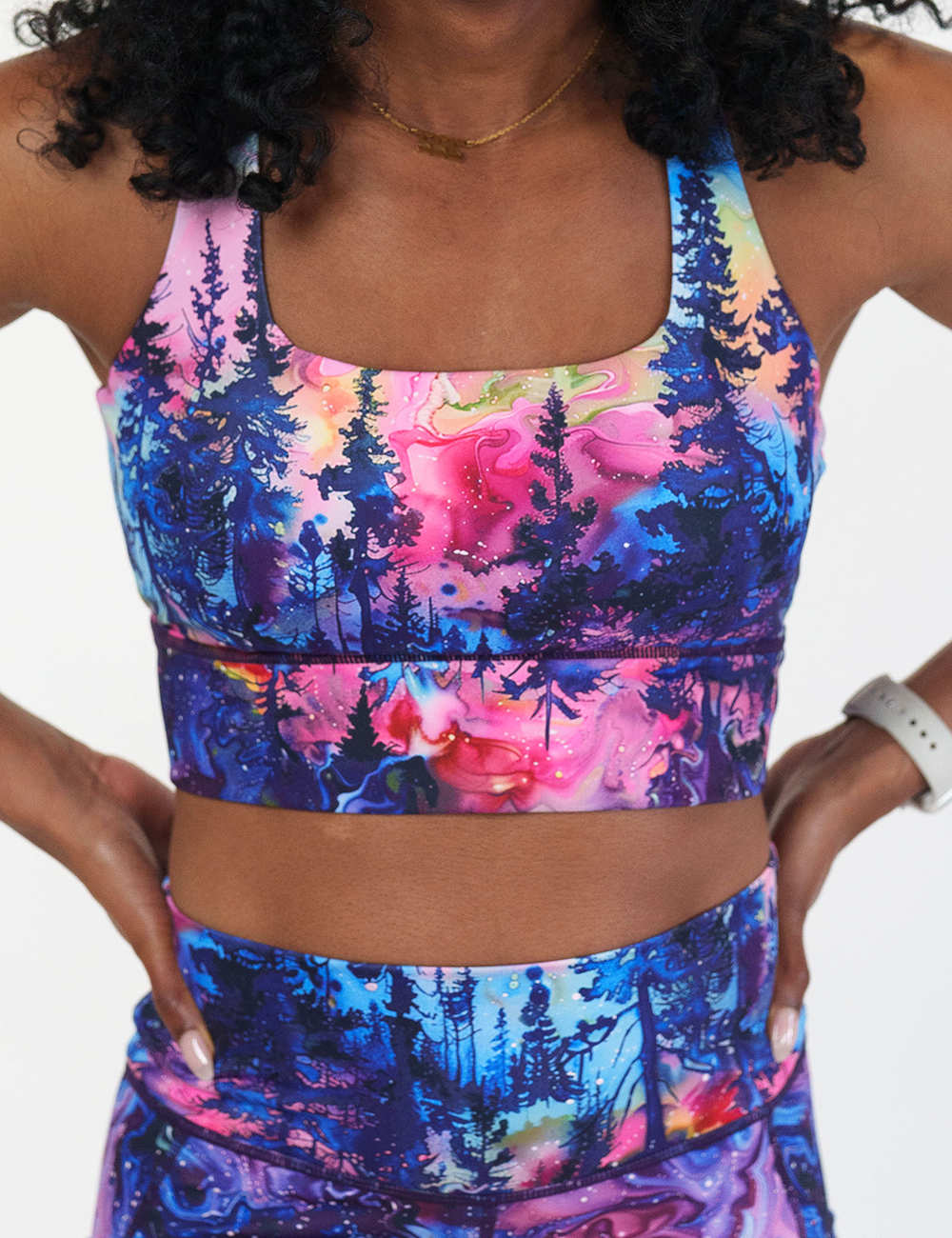 front of the watercolor rainbow patterned forest longline bra against a white background