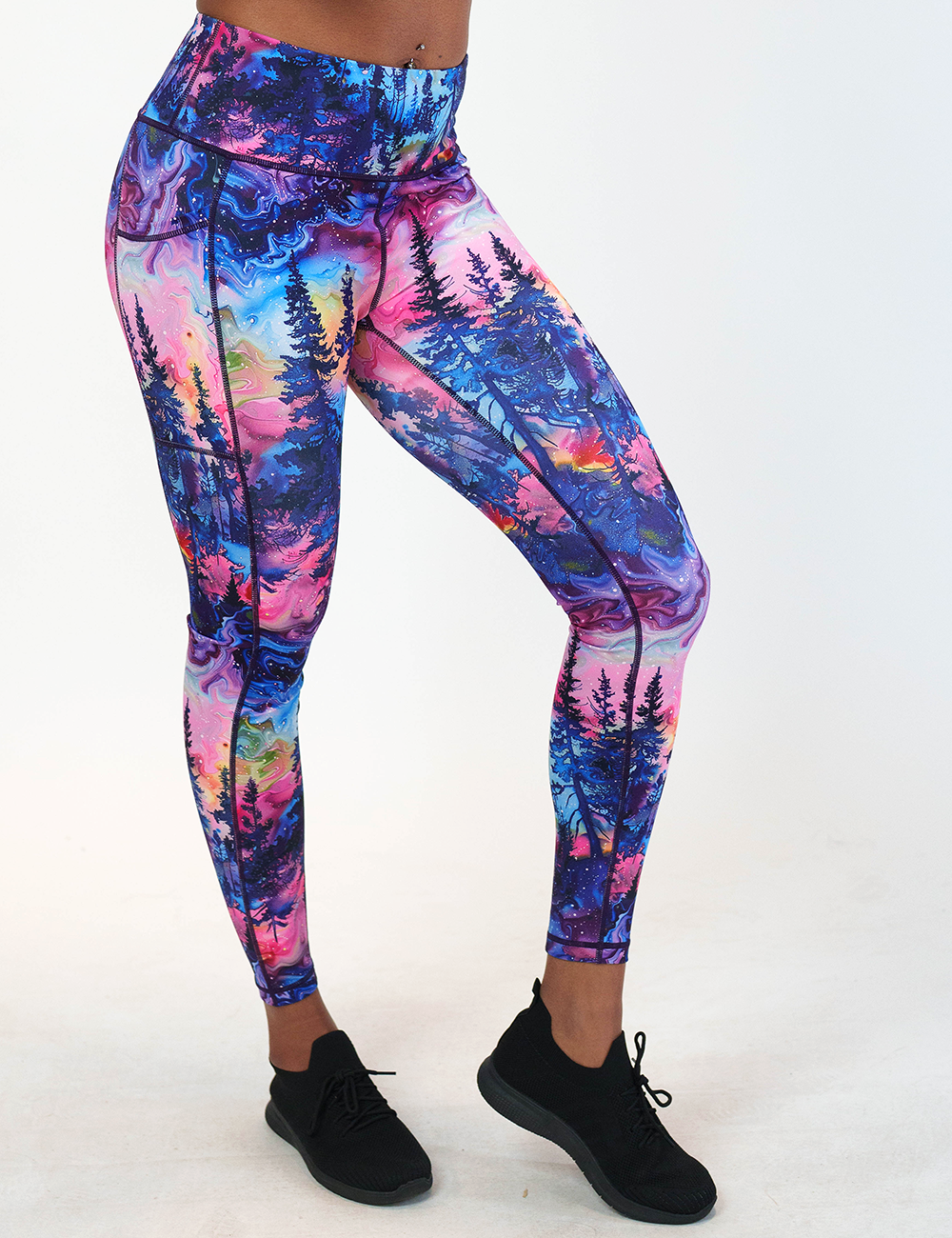 the watercolor rainbow patterned forest full length leggings against a white background