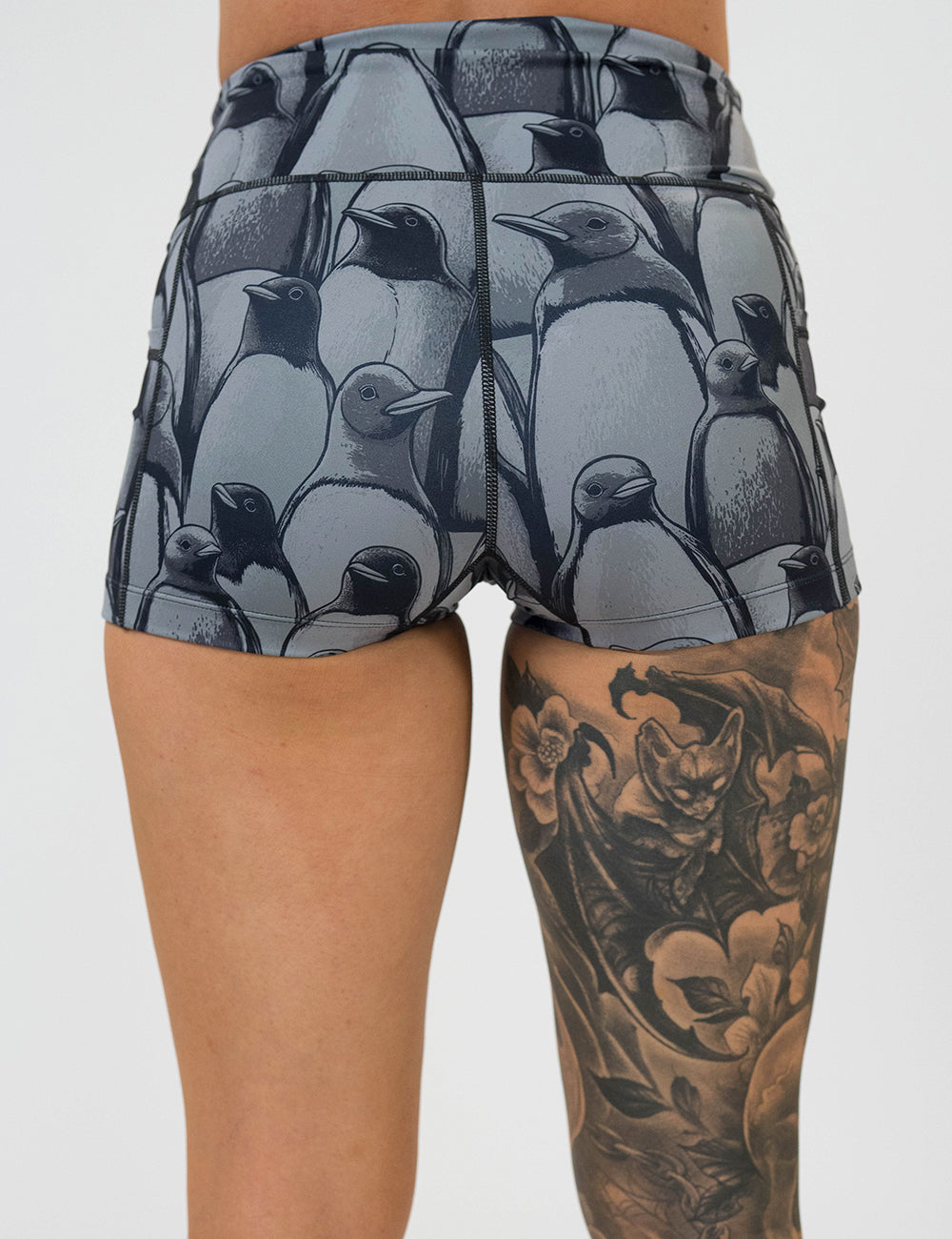 back of the 2.5 inch penguin patterned shorts against a white background