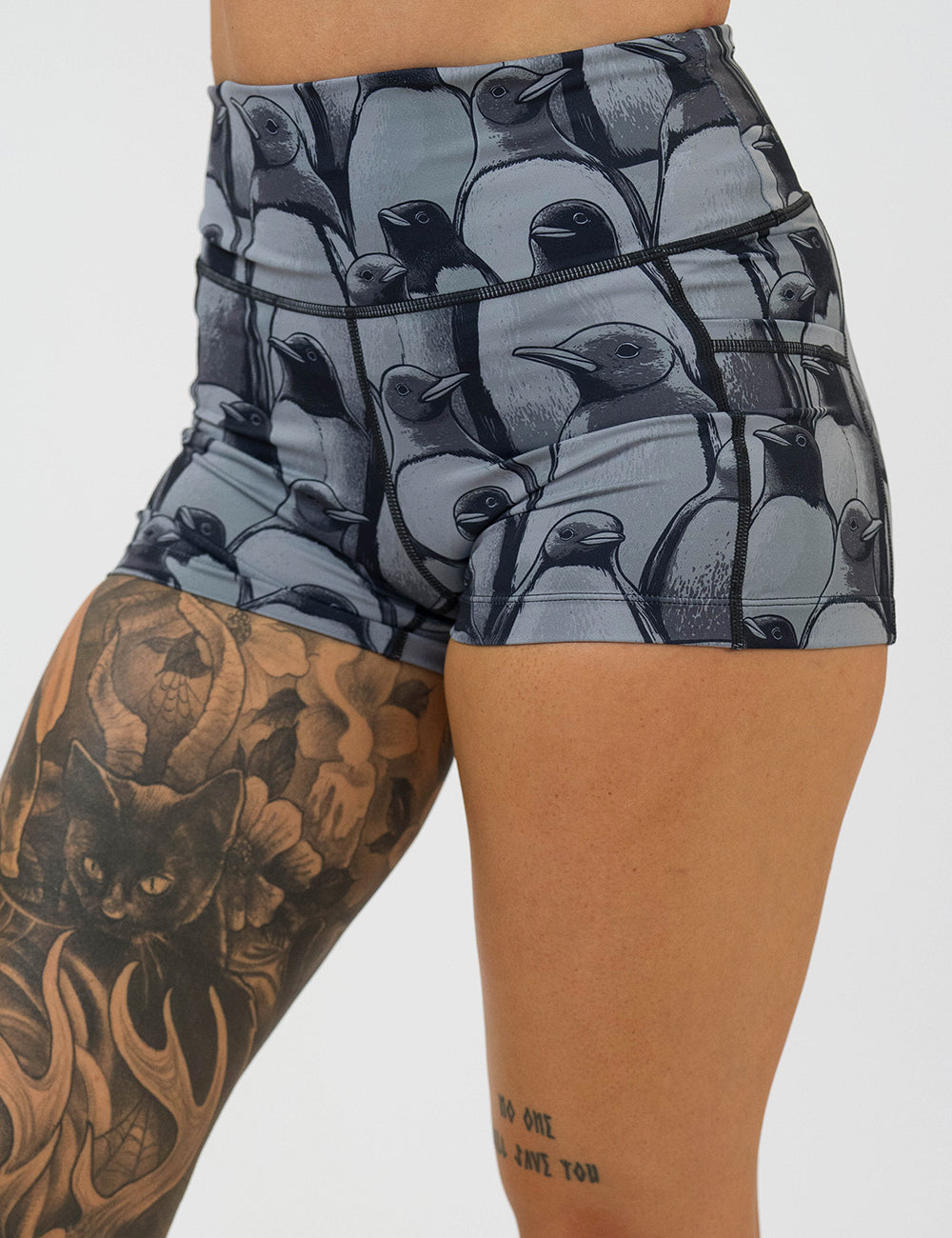 front of the 2.5 inch penguin patterned shorts against a white background