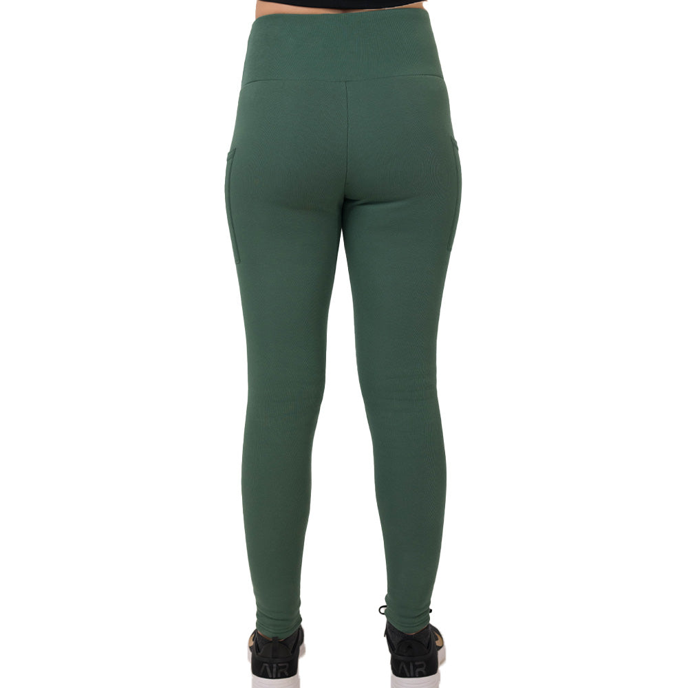 Green leggings worn by a person on a white background