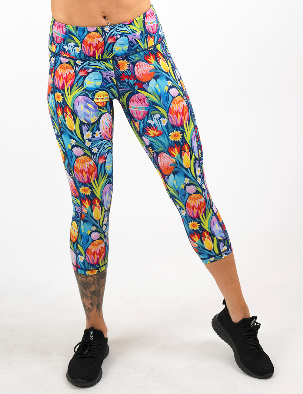 easter eggs in a field of flowers pattern capri leggings facing the front against a white background