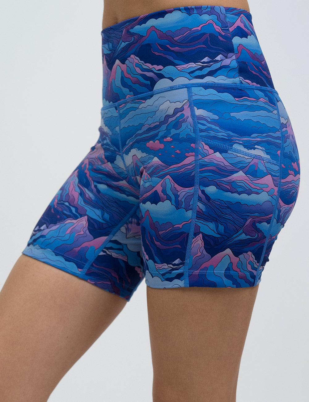 front of the 5 inch blue and pink mountains shorts against a white background