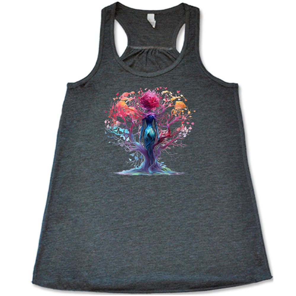 grey shirt with a colorful enchanted tree graphic in the center