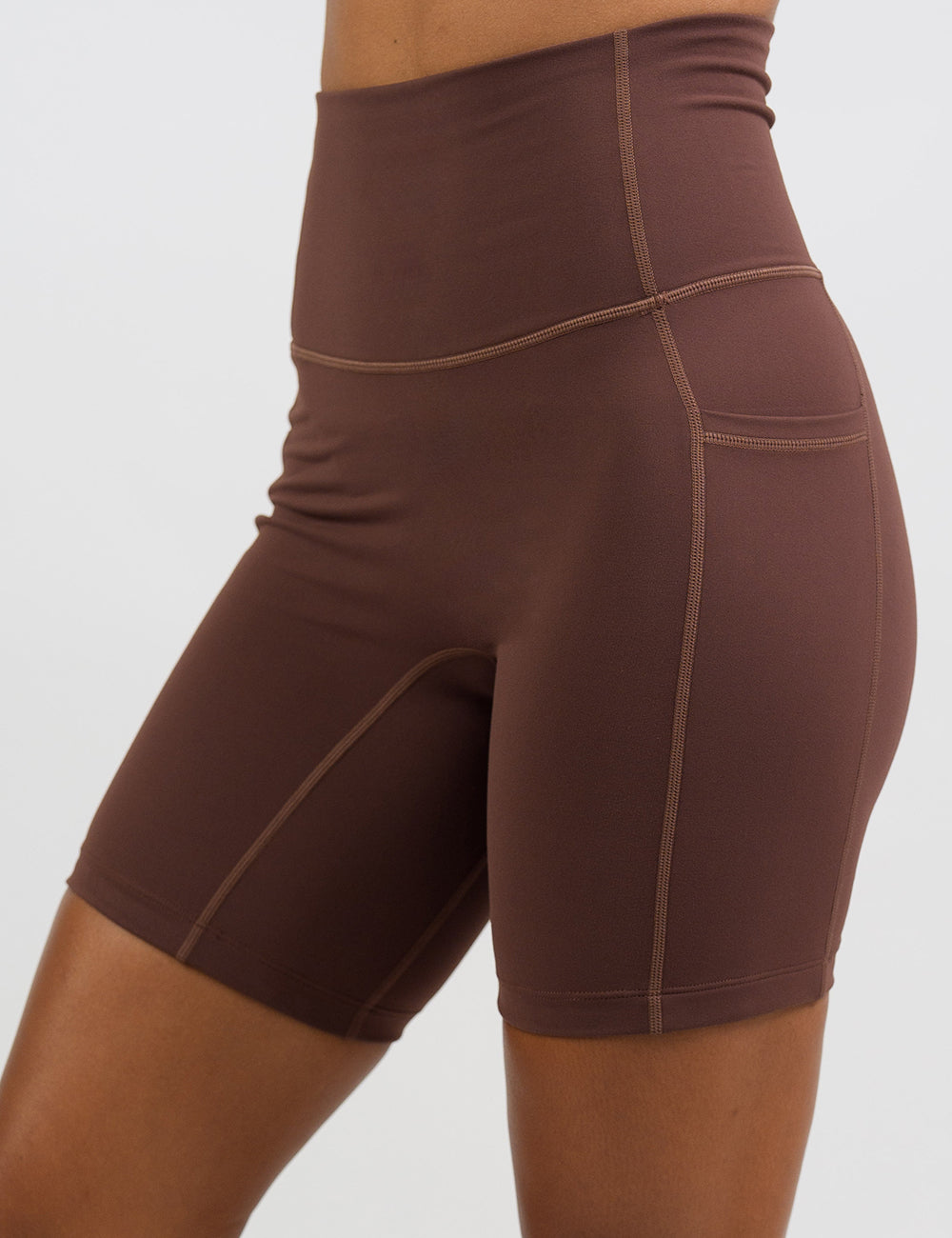 front of the solid light brown 5 inch shorts against a white background
