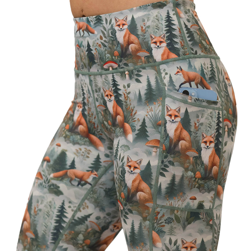 High-waisted leggings with fox and forest pattern on them
