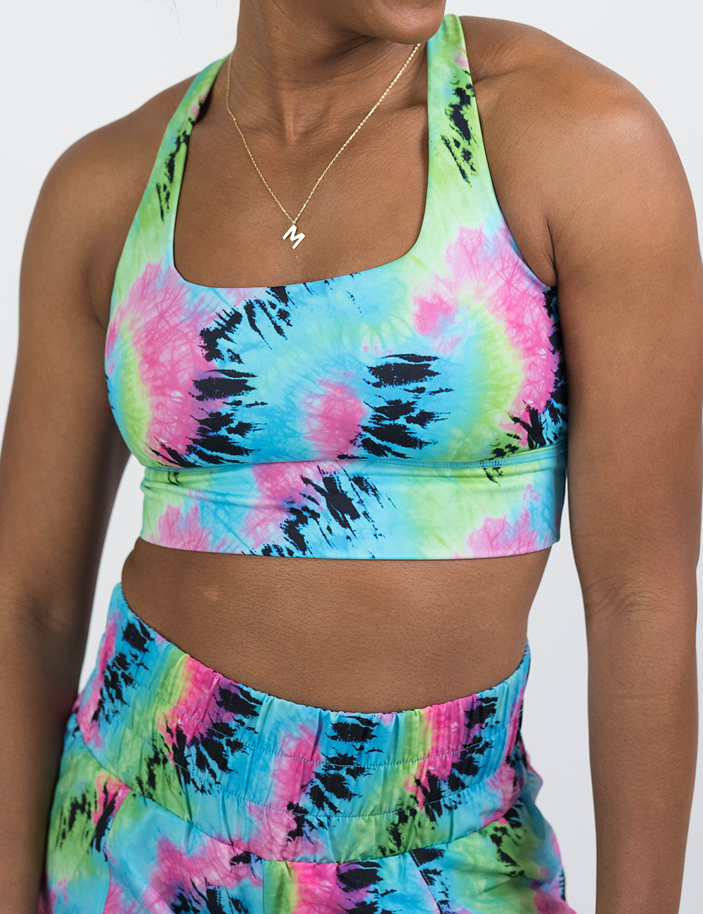 front of the colorful tie dye longline bra against a white background