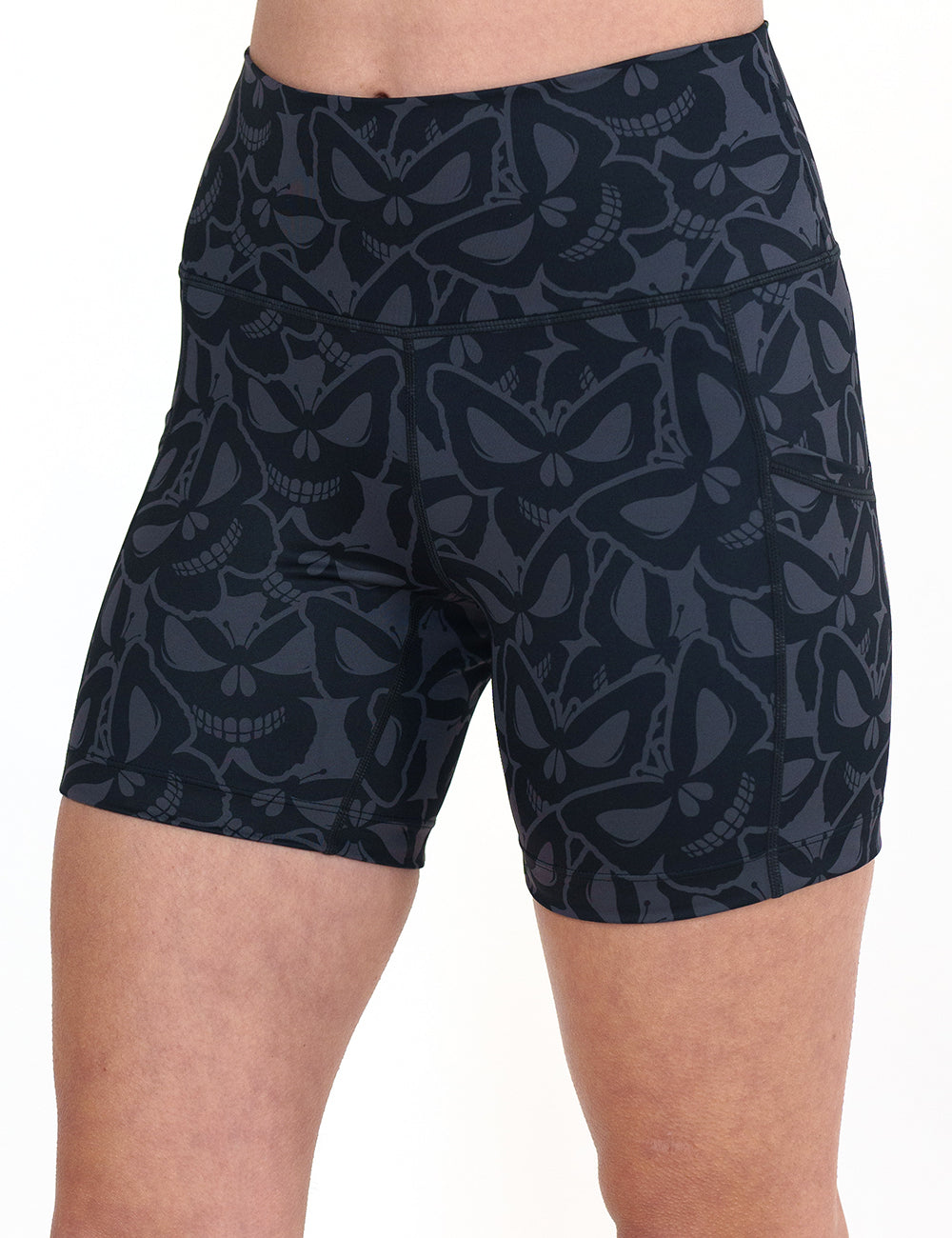 front of the 5 inch grey and black butterfly shaped skulls patterned shorts against a white background