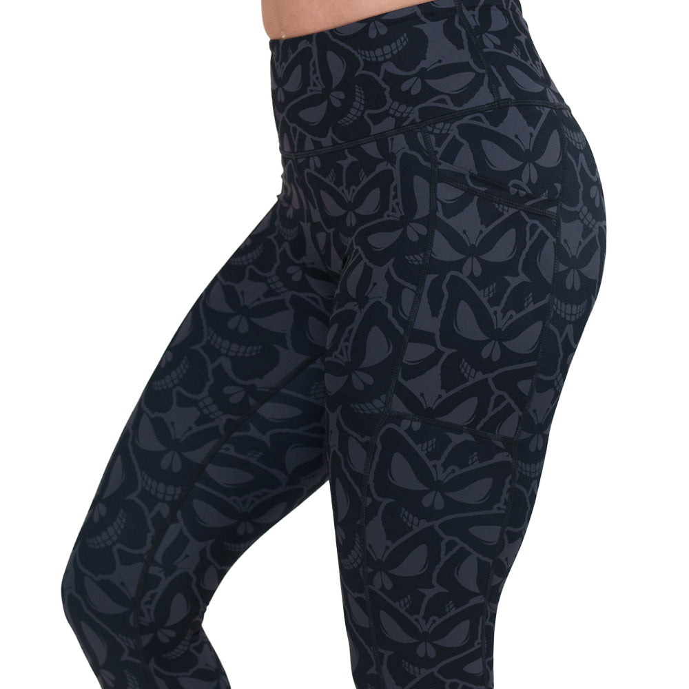 grey and black butterfly shaped skulls patterned leggings