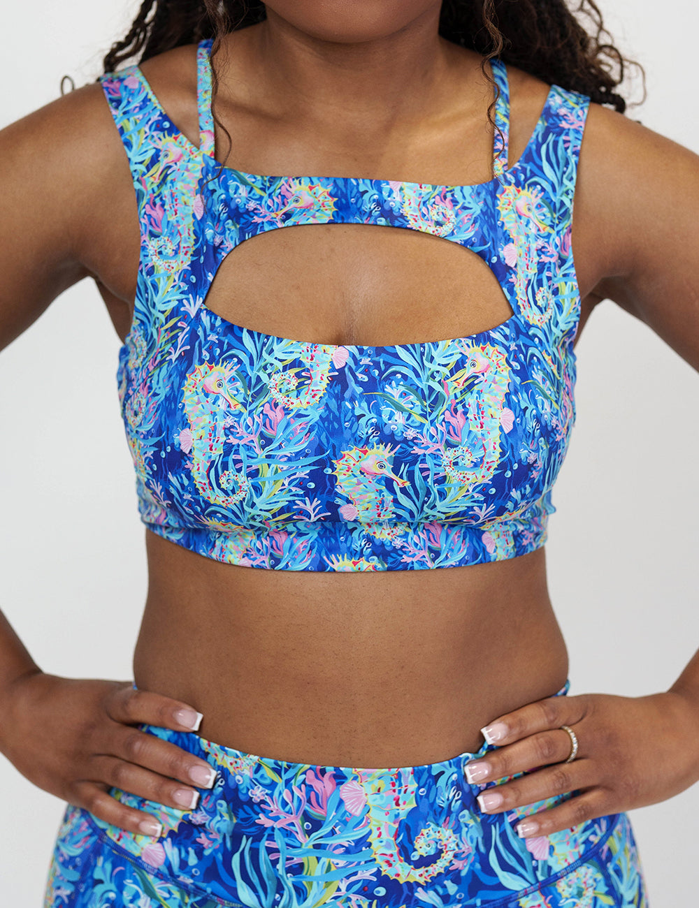 front of the colorful seahorse patterned bra