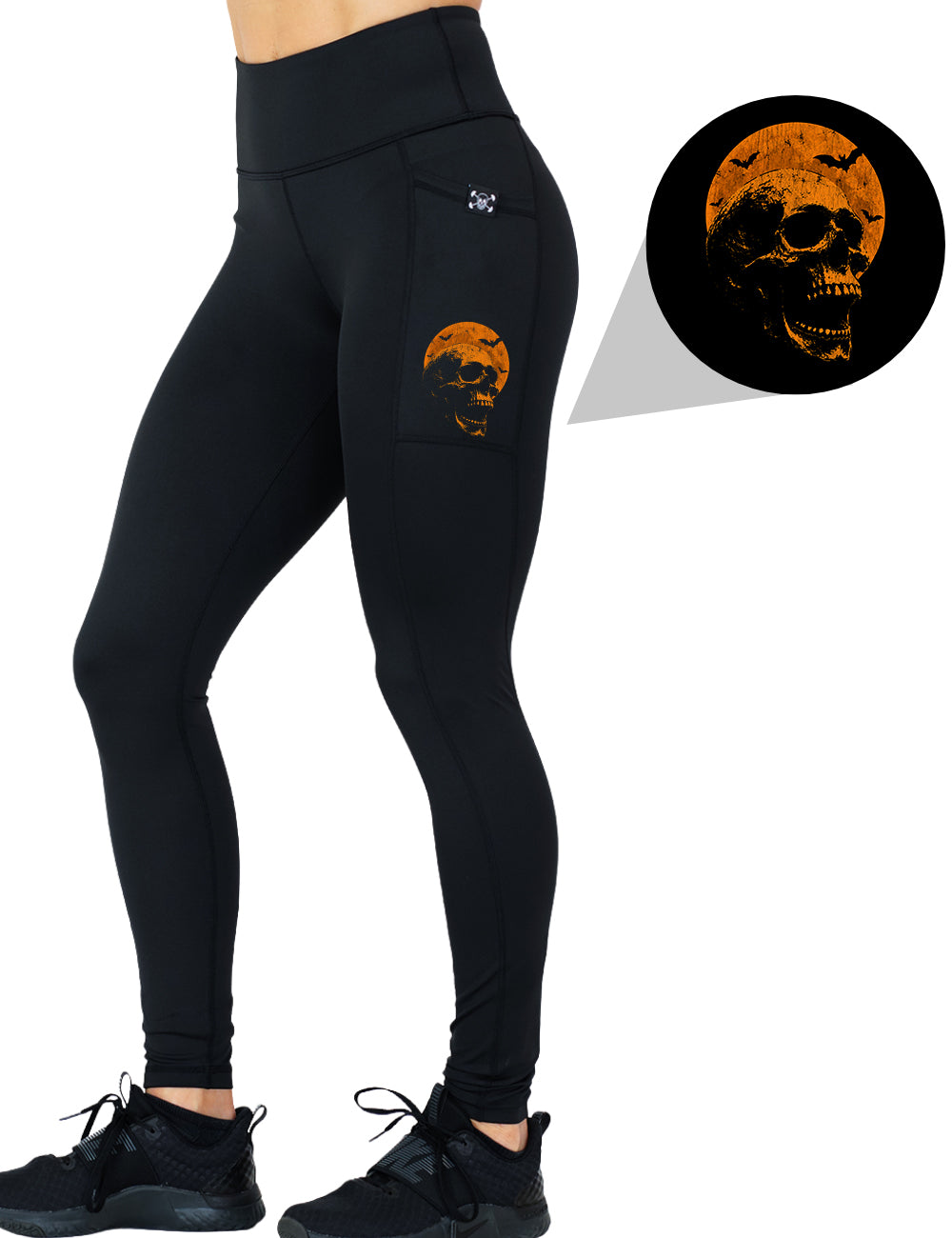 front of the orange skull against a orange moon graphic full length leggings