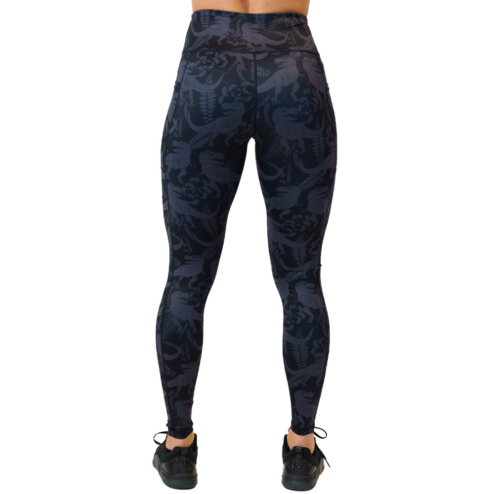 back view of full length black leggings with grey dinosaur pattern