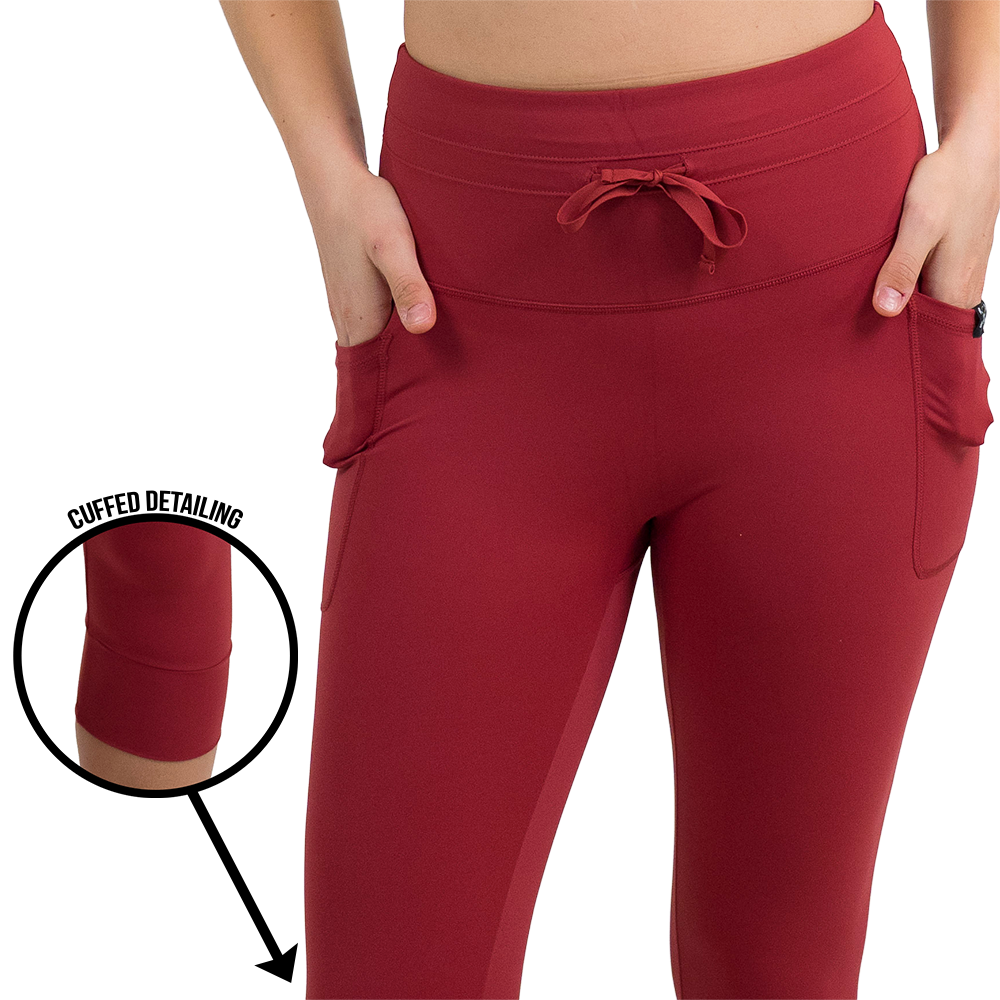 omni garnet red leggings facing the front, the cuffed detailing is shown via a magnified snap shot