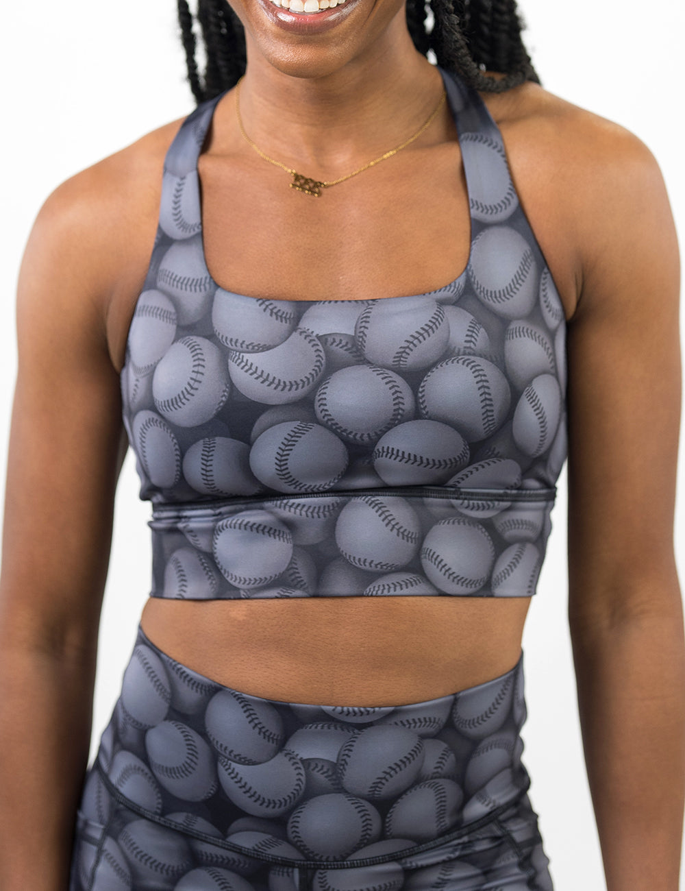 front of the dark grey baseball themed longline bra against a white background