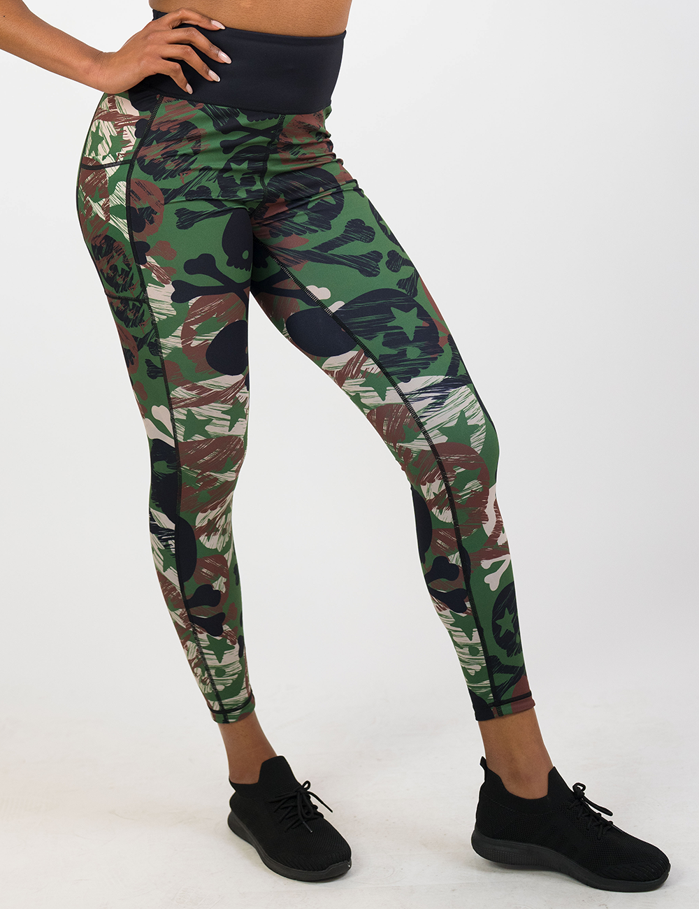model wearing the camo skull full length leggings against a white background