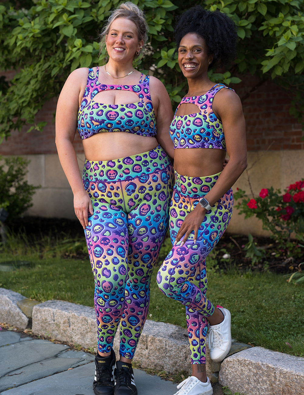 models wearing the rainbow leopard print pumpkins and skulls full length leggings and bras