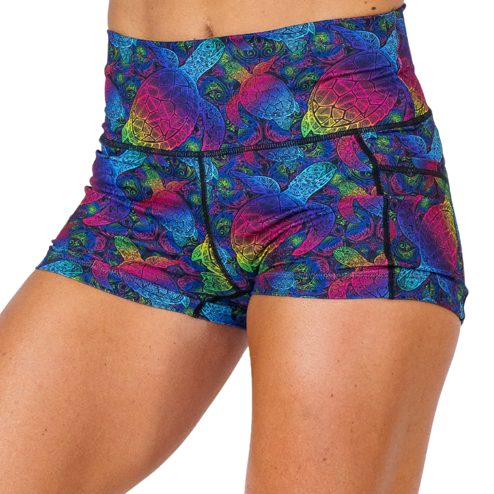pink, yellow, blue, green and purple ombre turtle print 2.5 inch shorts facing the front against a white background