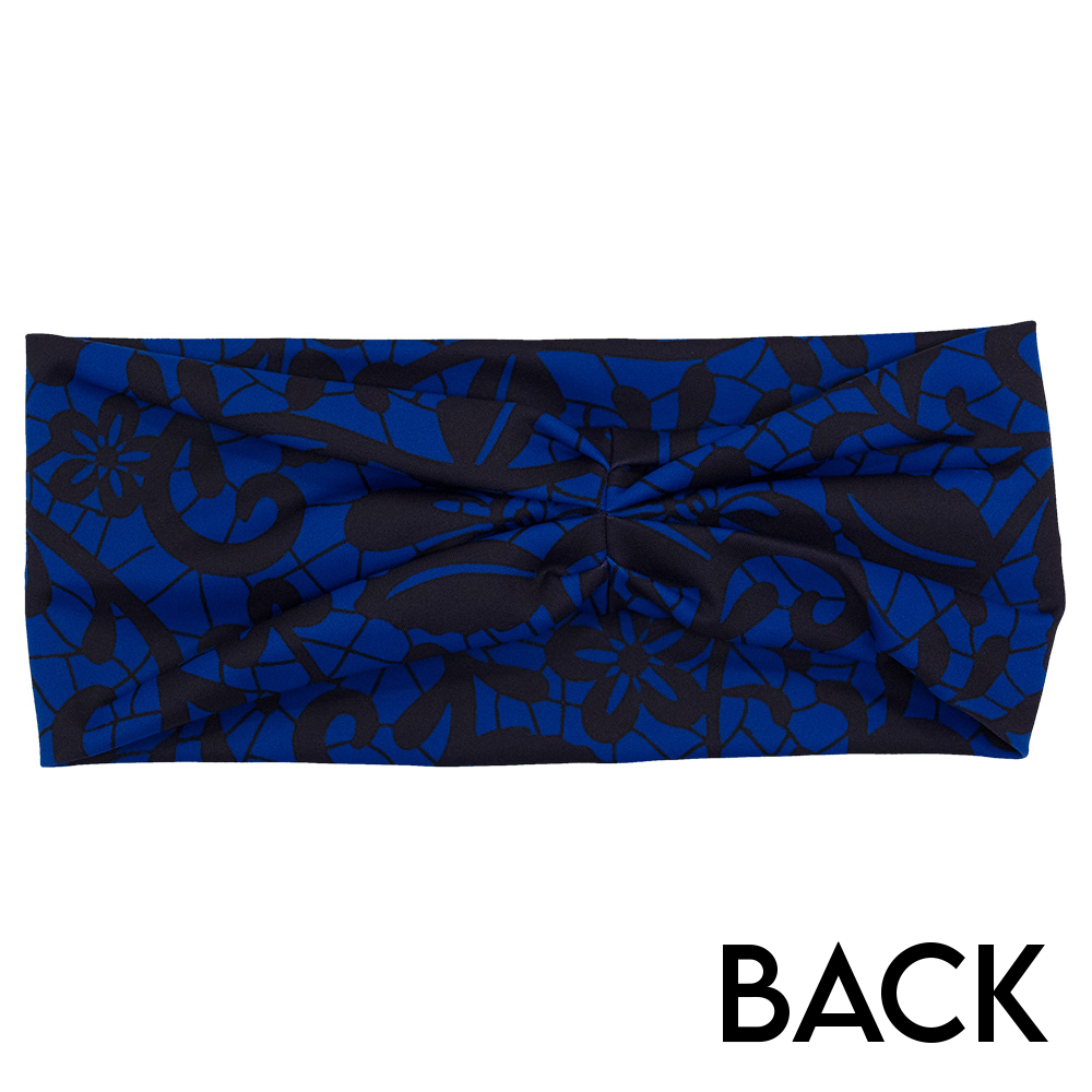back of the black floral against a dark blue background headband