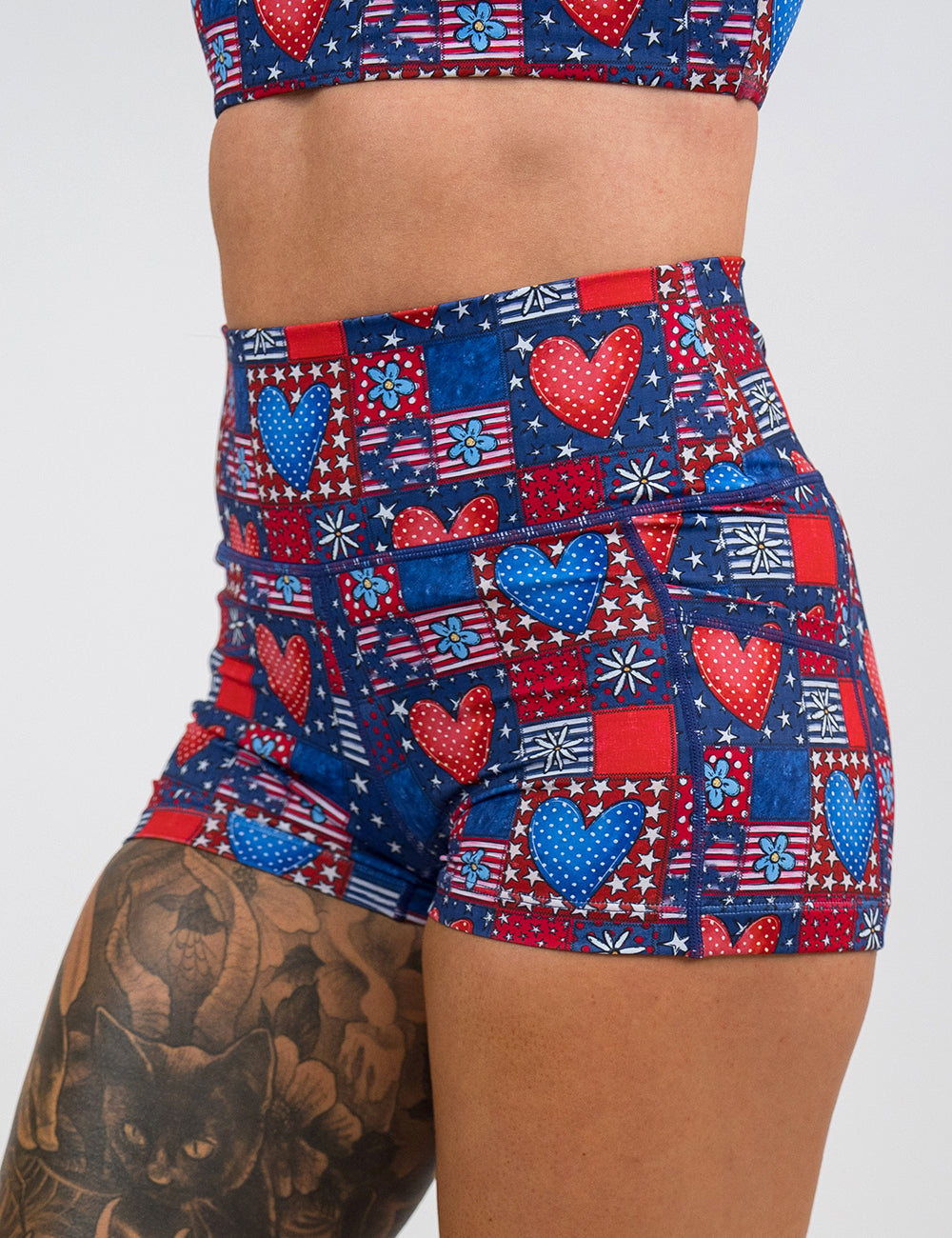front of the 2.5 inch patchwork american flag with red and blue hearts pattern shorts against a white background