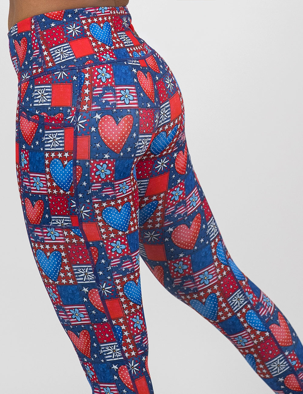 back of the red white and blue with hearts and flowers patchwork pattern leggings against a white background