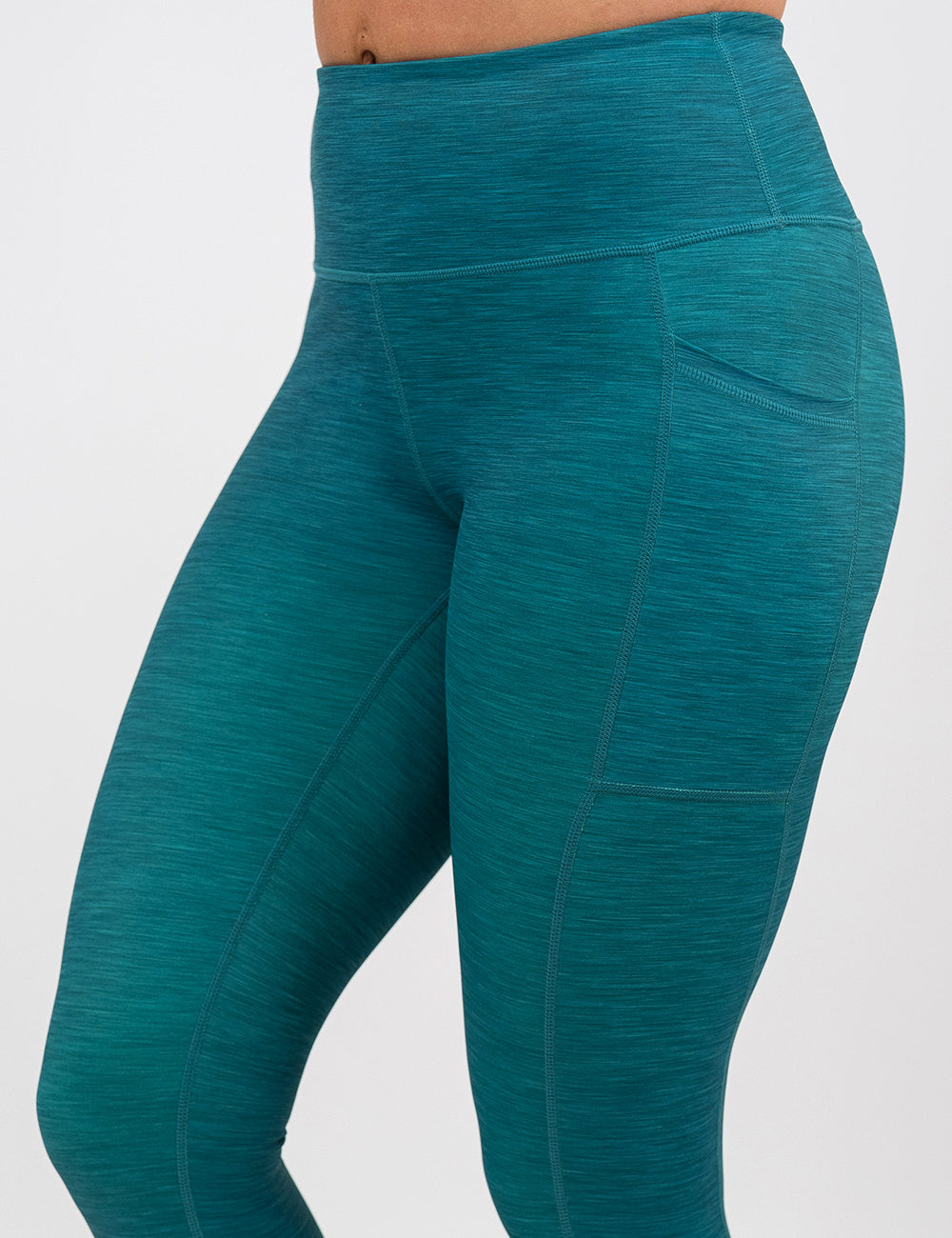 close up of the teal heather pattern leggings against a white background