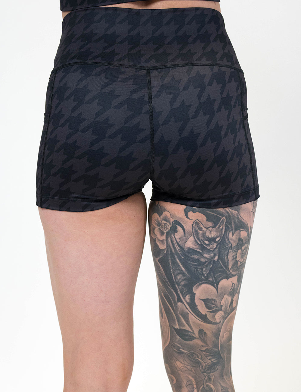 back of the 2.5 inch dark houndstooth pattern shorts against a white background