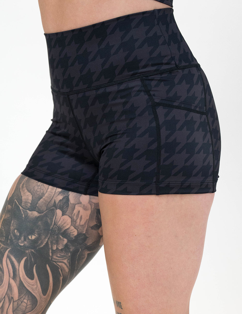 front of the dark houndstooth pattern 2.5 inch shorts against a white background