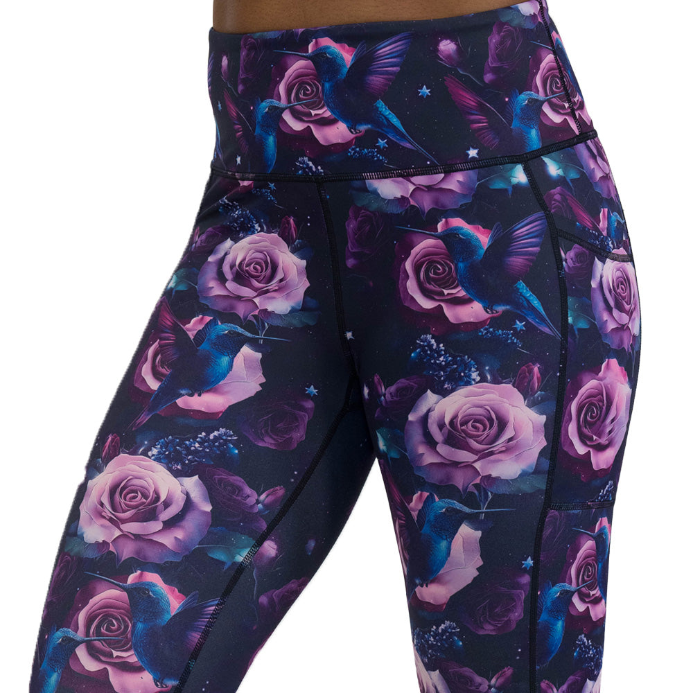 leggings with a design of a blue hummingbird and pink roses