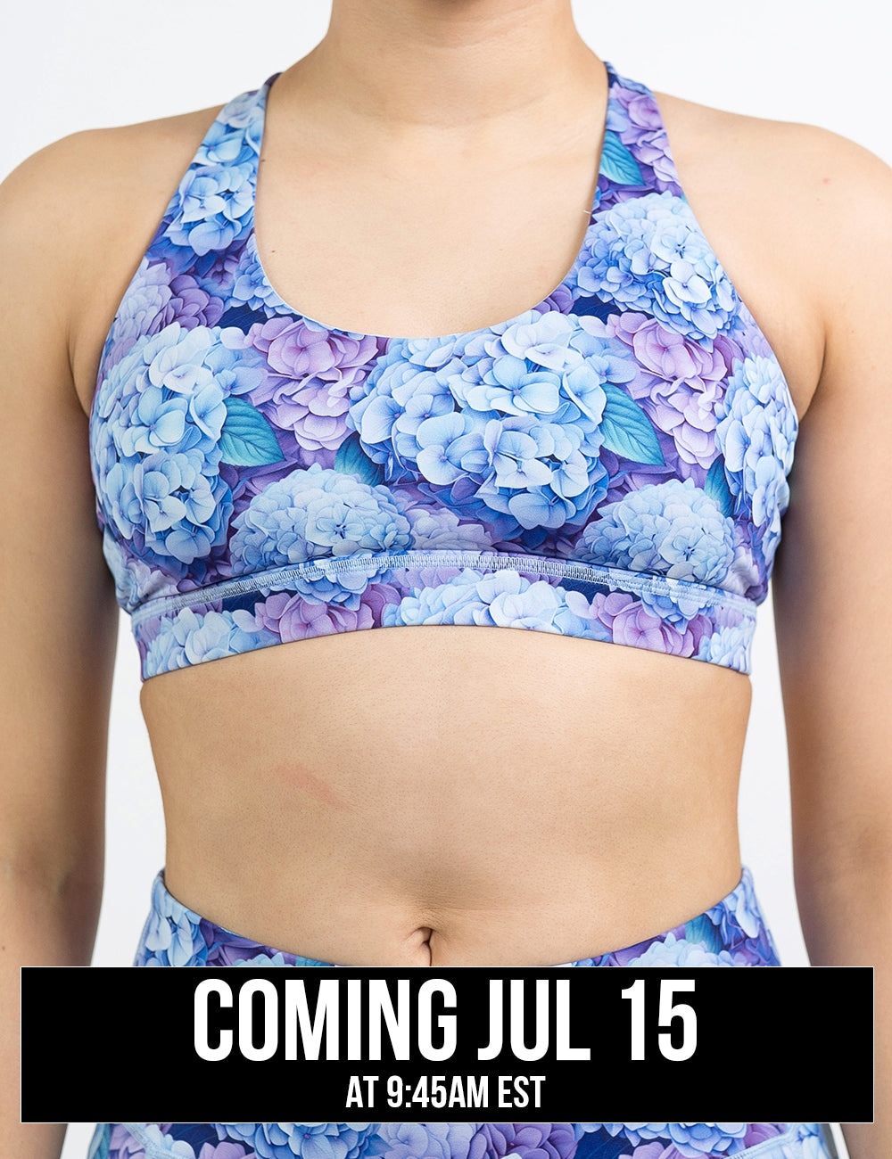 front of the pastel blue and purple hydrangea flower butterfly back bra against a white background, coming july 15th