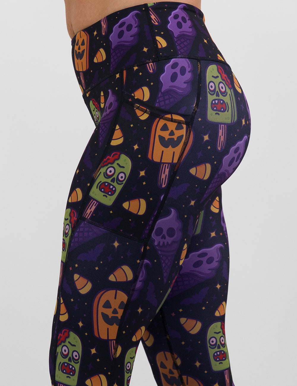 side view of the zombie, jack o lantern, and ghost ice cream's leggings against a white background
