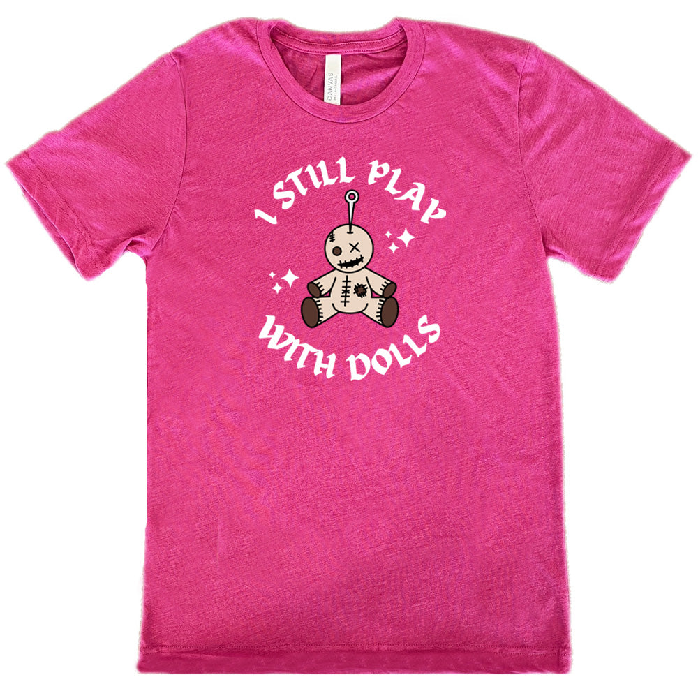 berry shirt that has a voodoo doll graphic and the text "i still play with dolls" on it