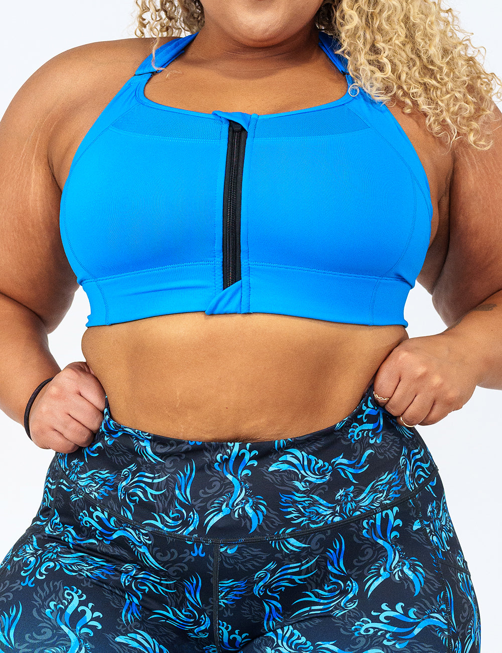 front view of solid blue front zipper sports bra