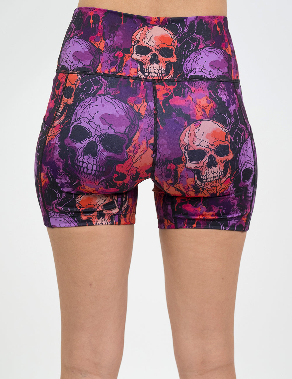 back of the 5 inch purple and orange skull patterned shorts against a white background