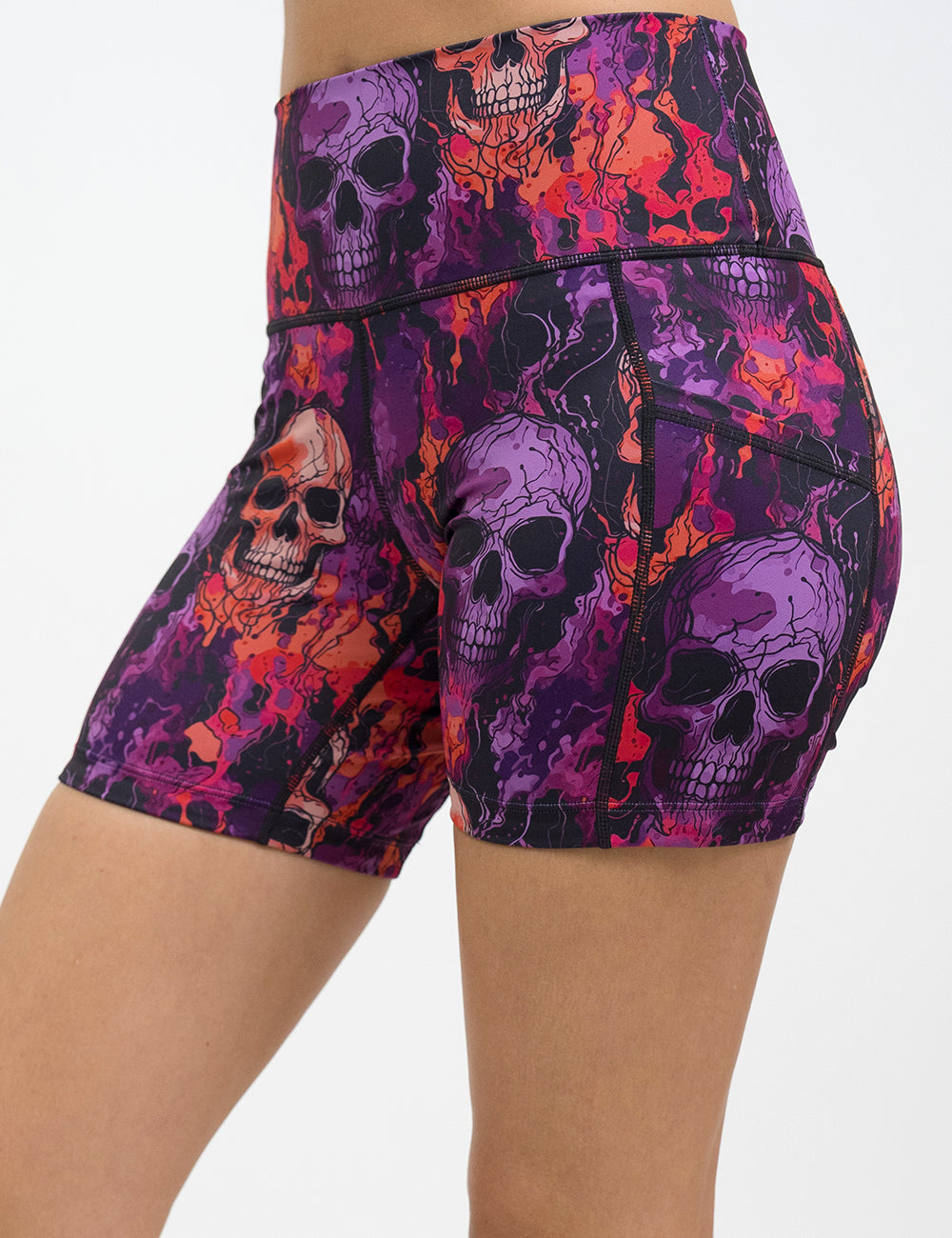 front of the 5 inch purple and orange skull patterned shorts against a white background