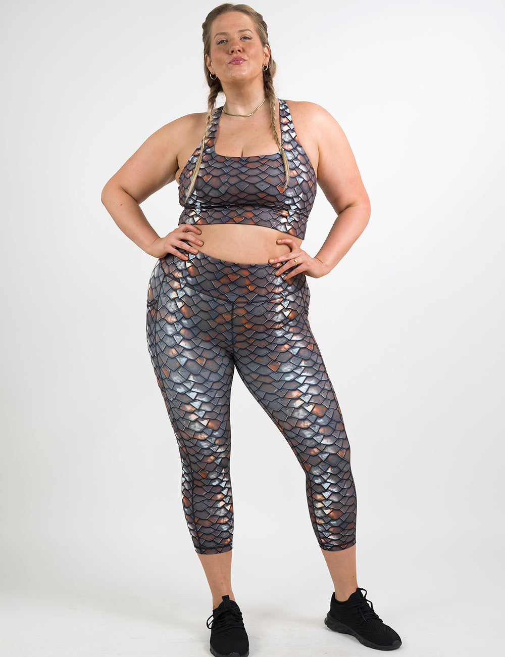 model wearing the iron sheet patterned capri leggings and bra against a white background