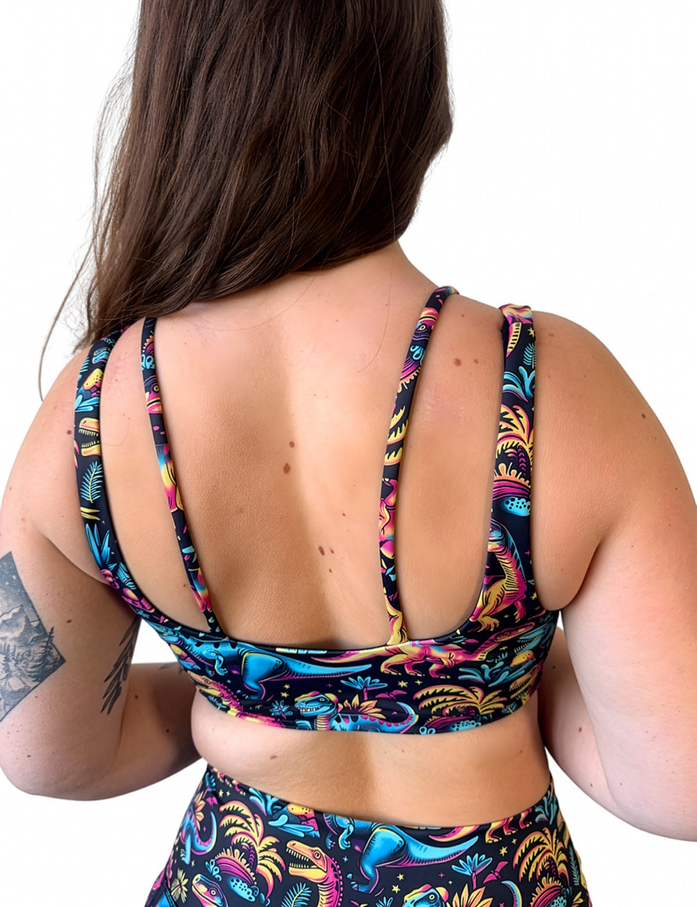 back of the dinosaur print vista bra against a white background