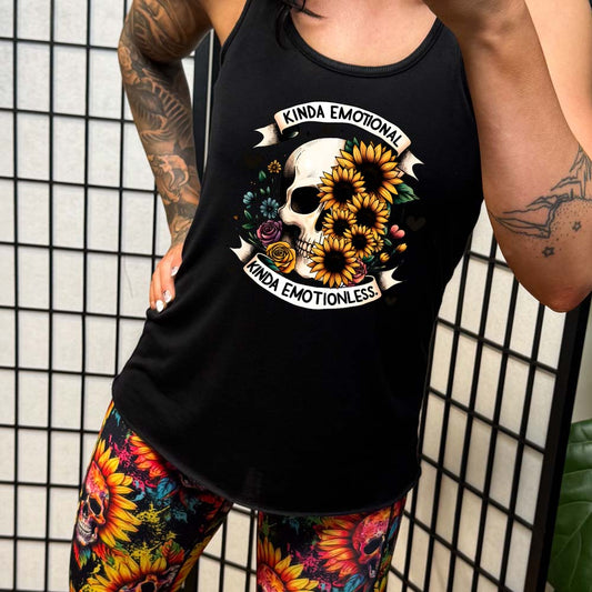 model wearing a black racerback shirt that has a skull and flower graphic with the quote "Kinda Emotional Kinda Emotionless" on it