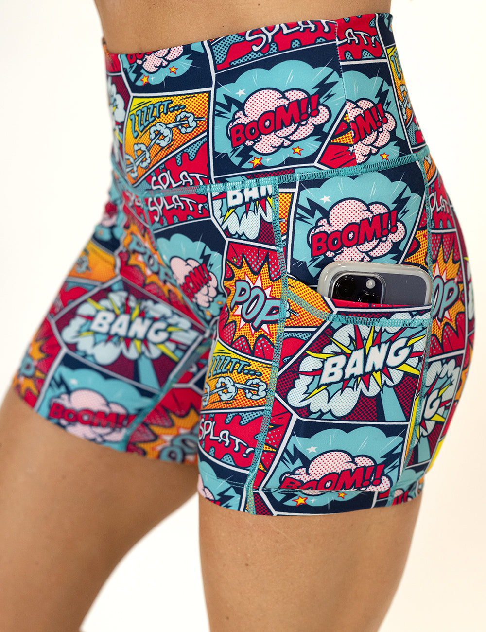 close up of the 5 inch pop art inspired shorts with a phone in its pocket