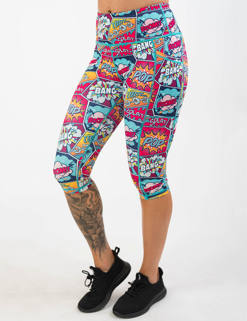 comic themed cropped leggings against a white background