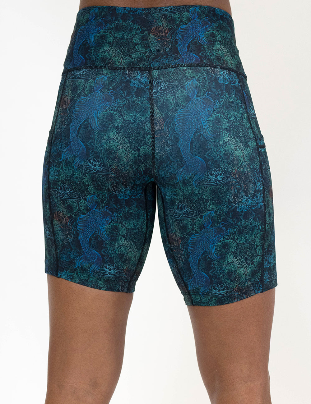 back of the 7 inch stenciled koi pattern against a blue background shorts against a white background