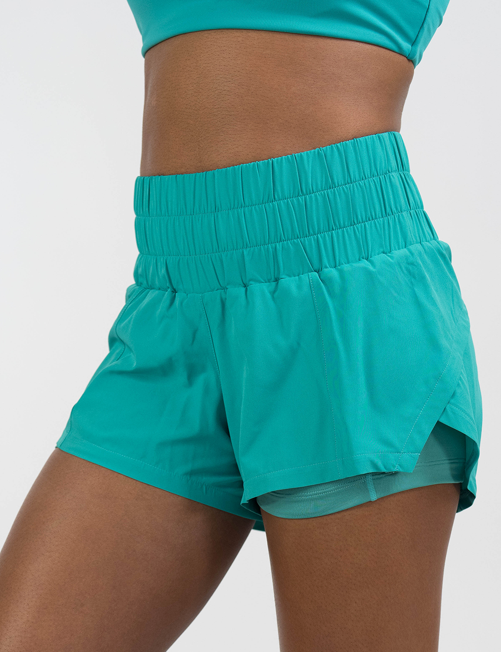 close up of the 3.5 inch teal day dream shorts facing the front against a white background