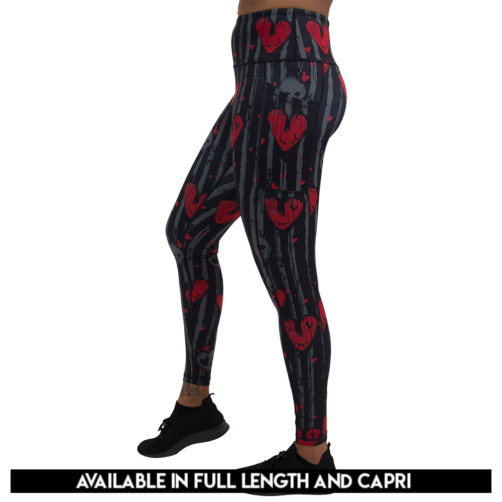 available lengths for the red heart and gray skulls against a black and grey striped background leggings, lengths include full length and capri